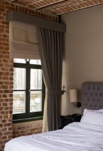 large-window-bedroom-with-red-brick-walls1 -re